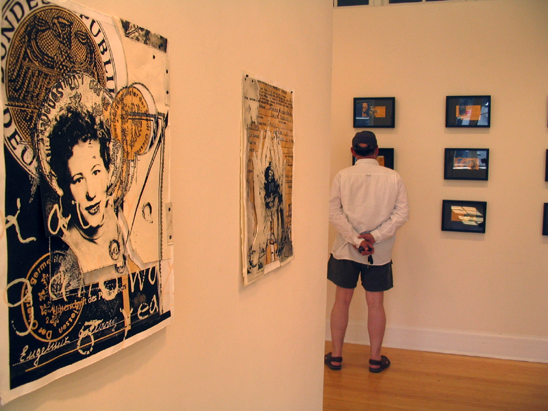 Photo of person viewing artwork in gallery